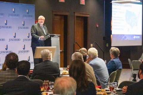 Ted Abernathy at podium speaking to audience at the 2025 Jonesboro Unlimited Annual Meeting