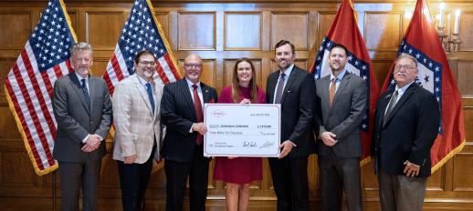 JU VP of Economic Development Steven Lamm, Jonesboro Mayor Harold Copenhaver, and Governor Sarah Sanders hold a large check for $3,010,000