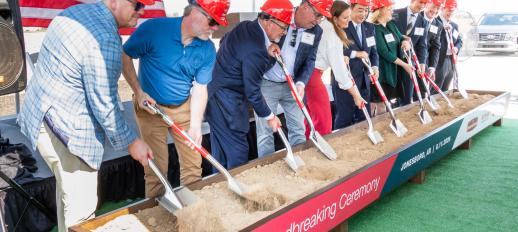 Officials shoveling dirt in a trough to symbolize the groundbreaking of InnovAsian's food manufacturing facillity in Jonesboro, Arkansas
