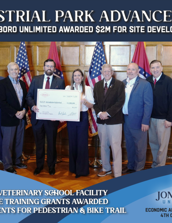 Cover of the Jonesboro Unlimited Economic Advancement Report for 4th Quarter 2024 showing JU Vice President Steven Lamm with large check with Governor Sanders and other state government officials